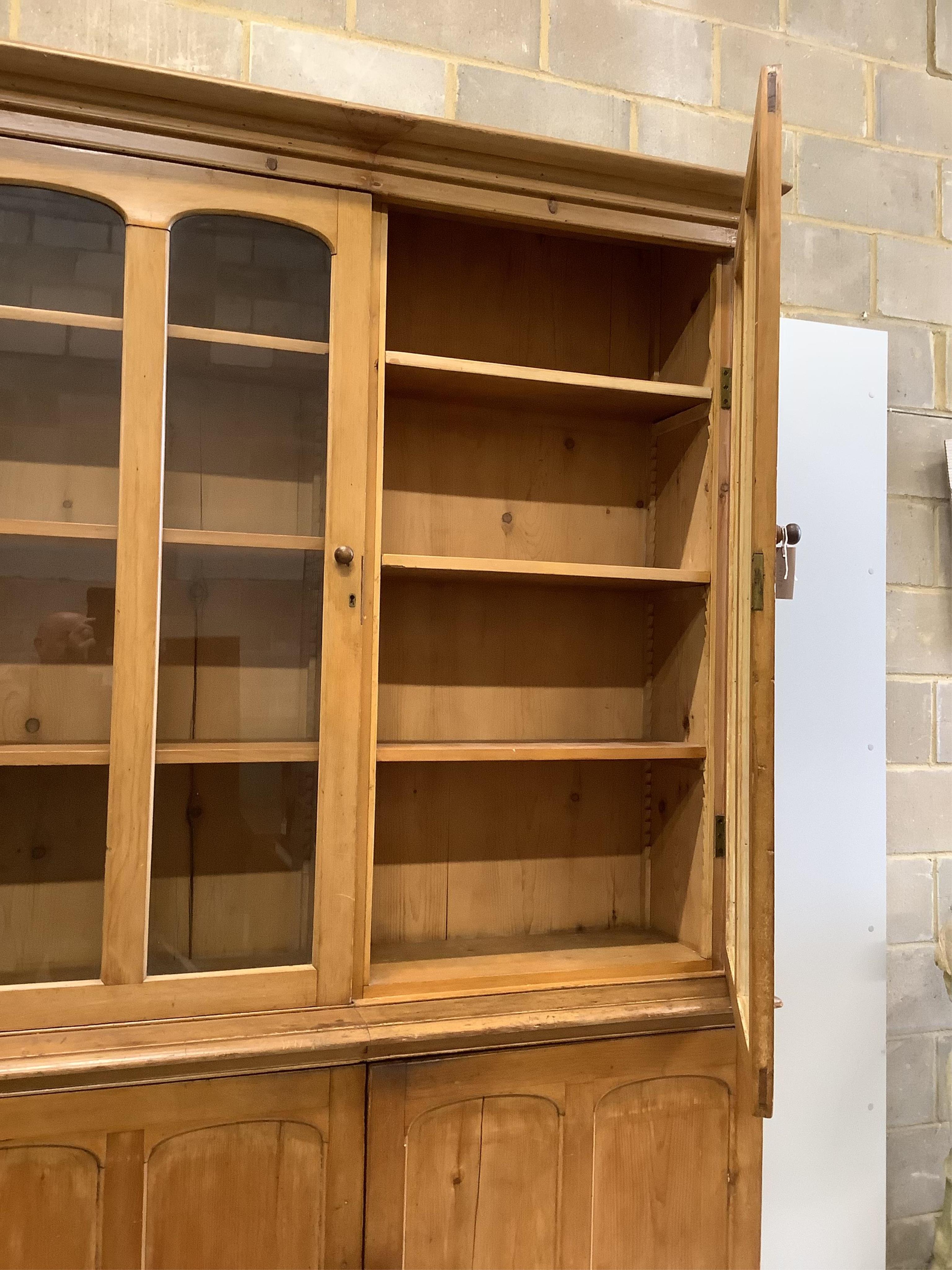 A Victorian pine library bookcase, width 154cm, depth 46cm, height 242cm. Condition - fair